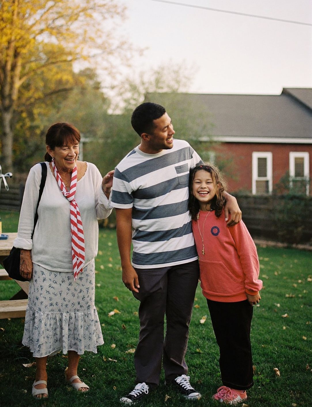 Three generations of a family in their backyard