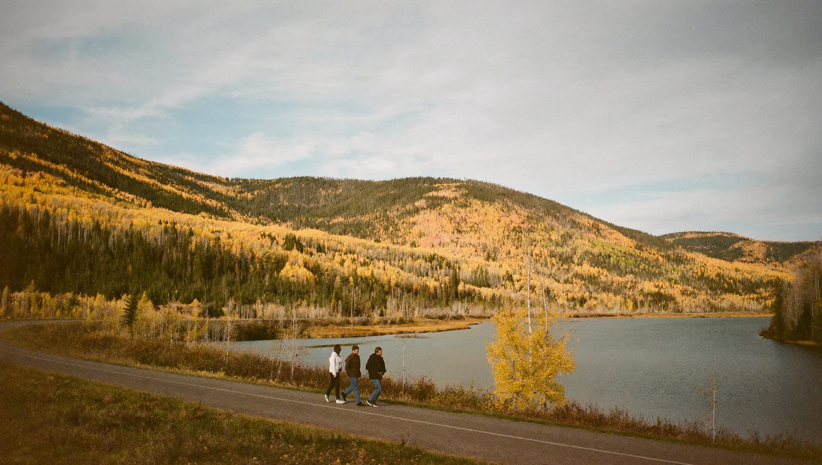 A family walking a riverside trail in the Red Deer river valley